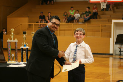 Image: 6th Grader, Patrick Hadley, was happy to win the Brass Caption Award.