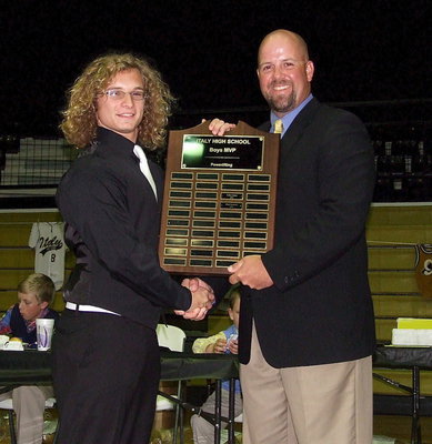 Image: Junior Shad Newman receives the 2013 Boys Powerlifting MVP Award from Coach Hank Hollywood.