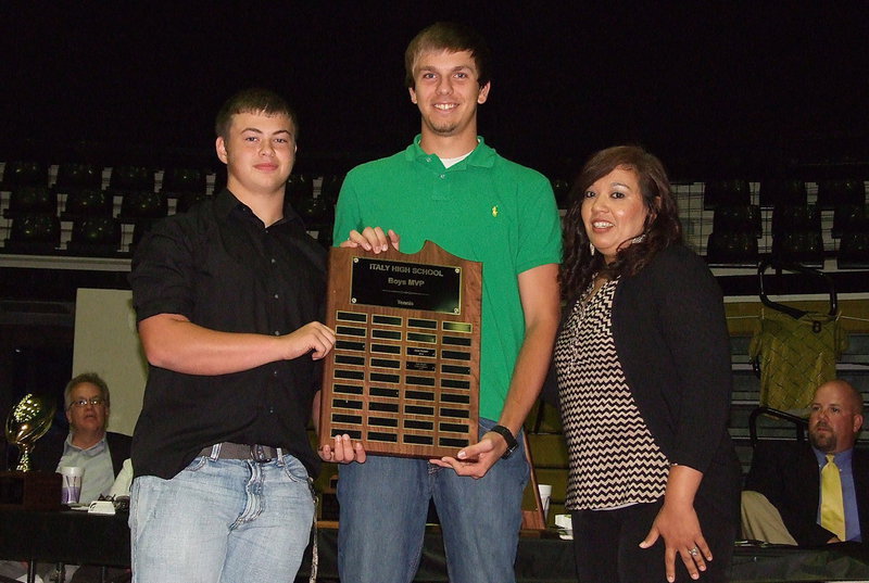 Image: Coach Tina Richards presents senior Cole Hopkins and junior Zain Byers with the Co-MVP Award in Tennis. Hopkins and Byers were district champions in boy’s doubles and finished 4th out of 32 teams to reach the regional semifinals.