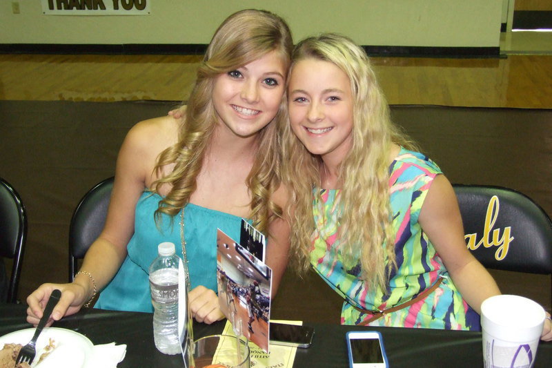 Image: Cousins Halee Turner and Britney Chambers, both freshman, share in the banquet excitement together.