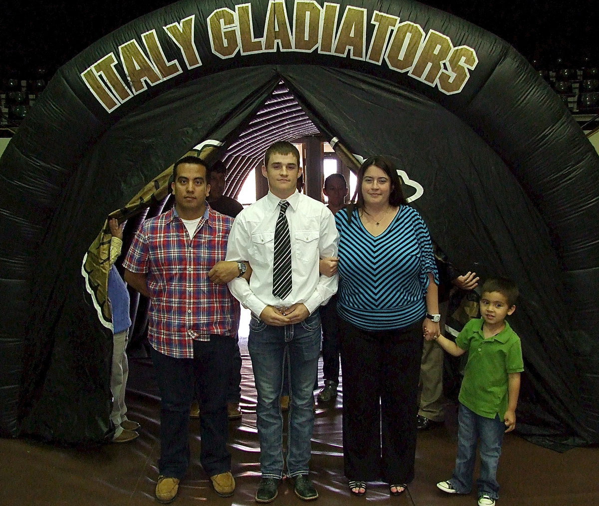 Image: Senior Hayden Woods is escorted into the banquet by his family.