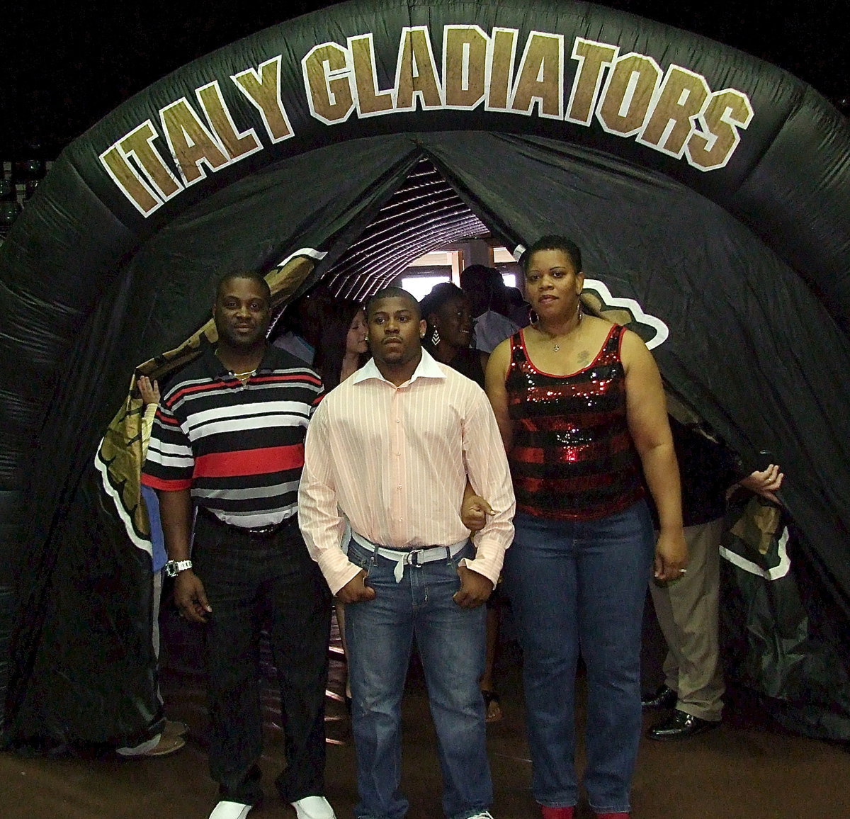 Image: Senior Jalarnce Jamal Lewis is escorted into the banquet by his family.