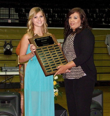 Image: Halee Turner is presented the 2013 Girls Cross Country Team MVP Award by coach Tina Richards.