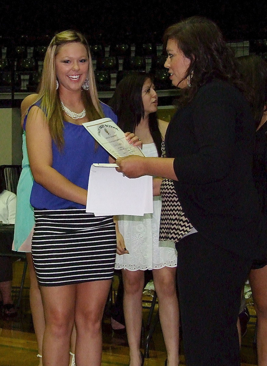 Image: Sophomore Bailey Eubank is recognized as a memebr of the Lady Gladiator Volleyball team with assistant coach Tina Richards presenting Eubank with her certificate.