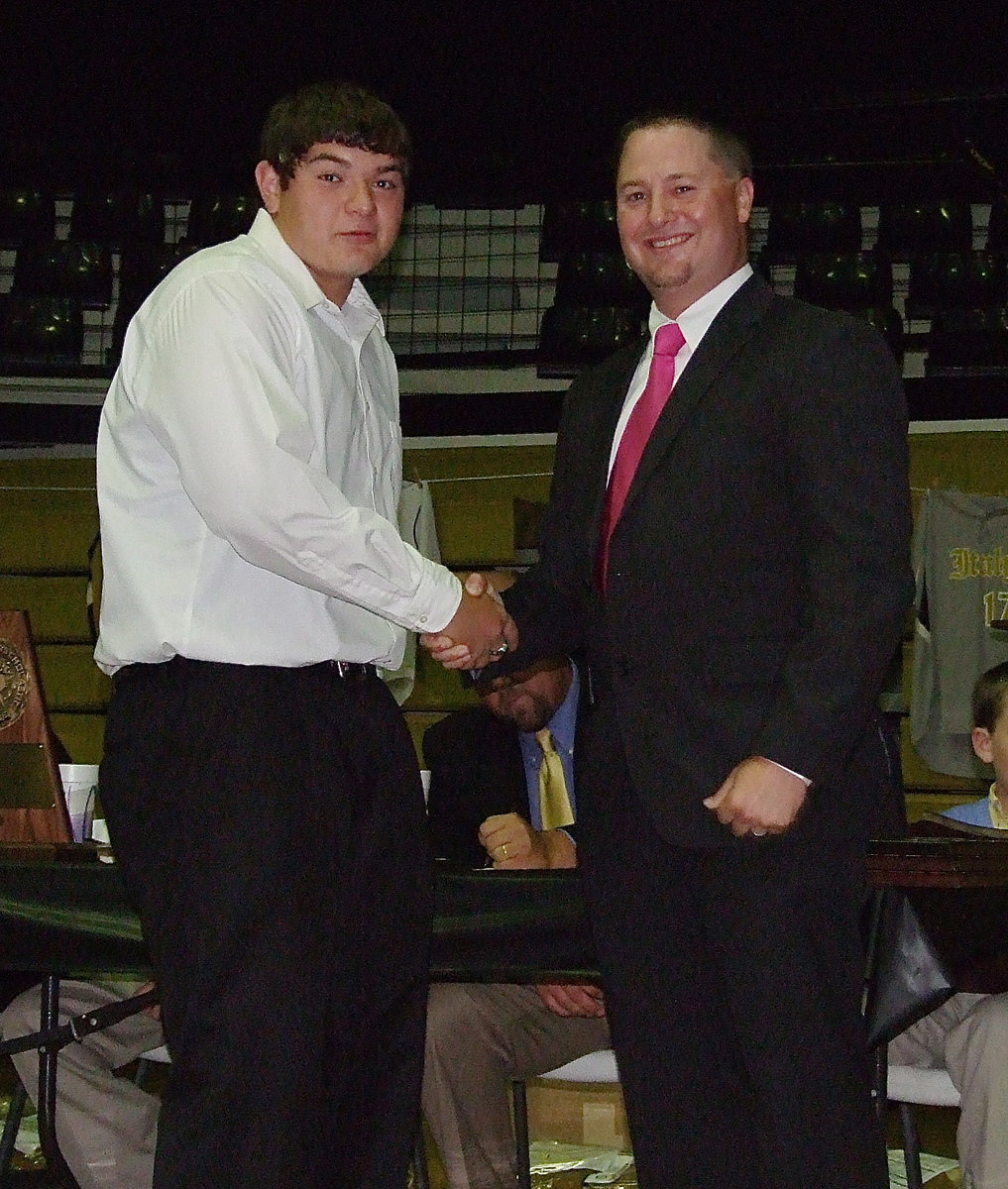 Image: Congratulating junior Kevin Roldan who was a key contributor to the Italy Baseball team this season is head baseball coach Josh Ward.