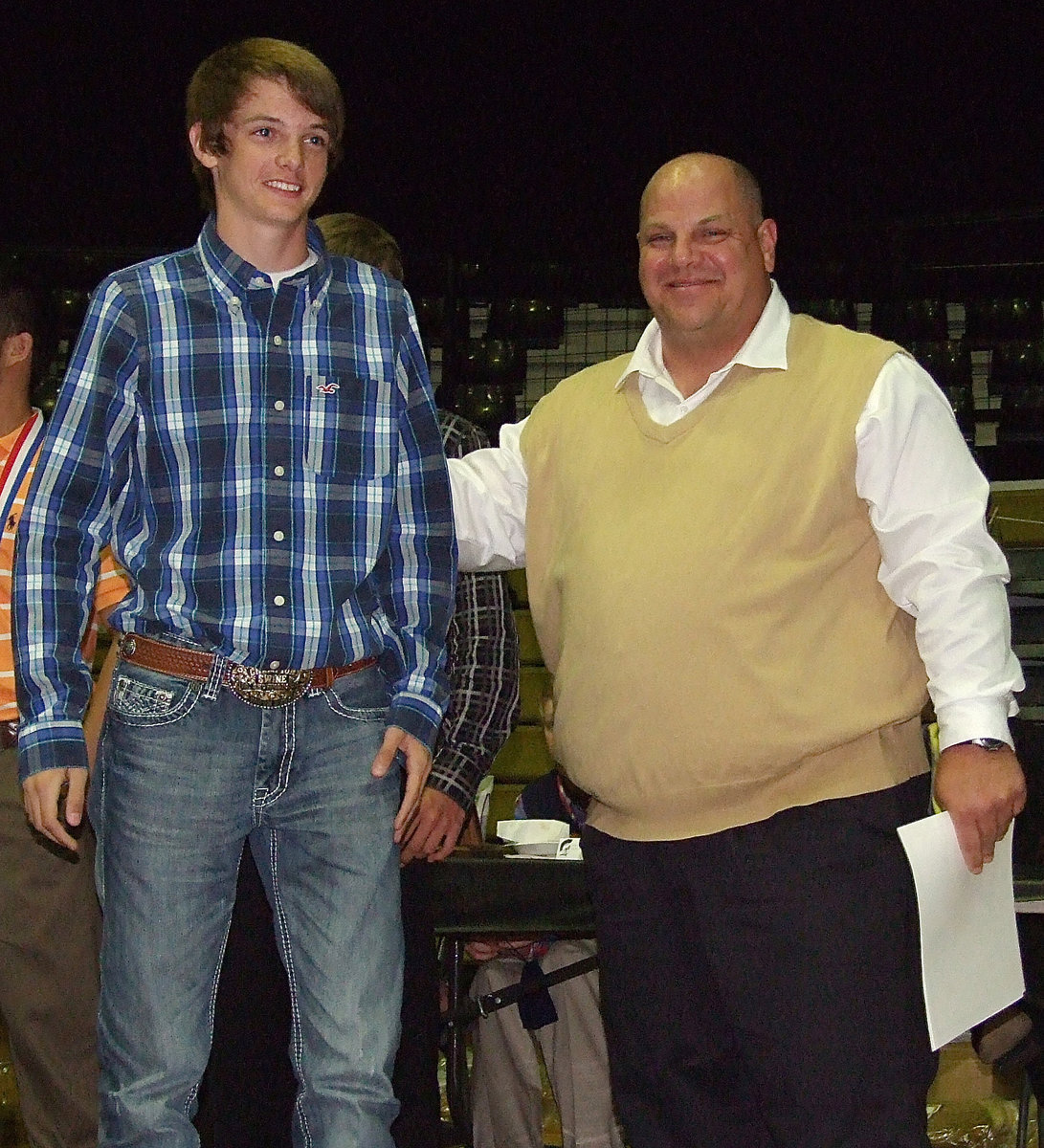 Image: Freshman baseball standout Ty Windham receives a certificate as a member of the Italy Baseball team with assistant coach Brian Coffman presenting.