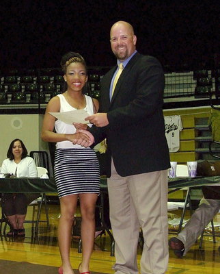 Image: Coach Hank Hollywood presents Ryisha Copeland with her track certificate. Copeland was part of Italy Track &amp; Field’s 4×100 Relay team that competed at State in Austin.
