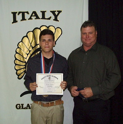 Image: Pictured with his father, Rusty Merimon, is freshman Gladiator, Hunter Merimon, who displays his State semifinal medal and certificate of achievement.