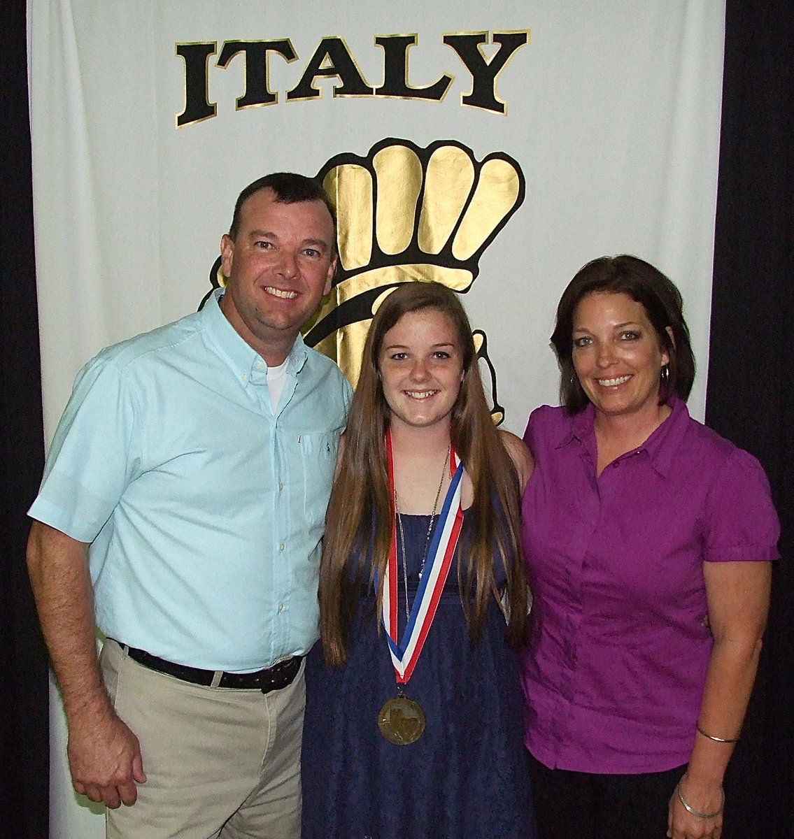 Image: Pictured with parents, Paul Cockerham and Dustie Jones, sophomore, Reagan Cockerham, displays her State semifinal medal as the team’s talented videographer.