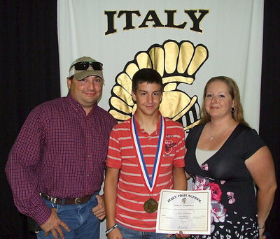 Image: Pictured with parents, Jason and Misty Escamilla, team manager, Gary Escamilla, displays his State semifinal medal and certificate of achievement.