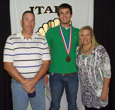 Image: Pictured with parents, Brad and Cassandra Hopkins, senior Gladiator, Cole Hopkins, displays his State semifinal medal and certificate of achievement.