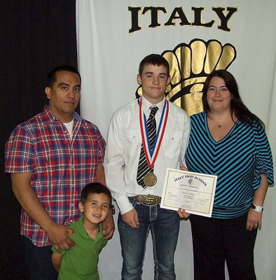 Image: Pictured with his family, senior Gladiator, Hayden Woods, displays his State semifinal medal and certificate of achievement.