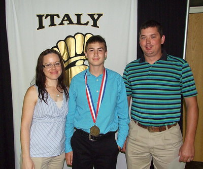 Image: Pictured with his parents, Summer Douglass and Stephen Connor, is freshman Gladiator, Brandon Connor, who displays his State semifinal medal and certificate of achievement.