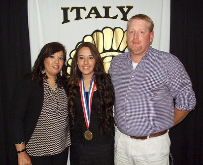 Image: Pictured with parents, Tina and Allen Richards, senior statistician, Alyssa Richards, displays her State semifinal medal.