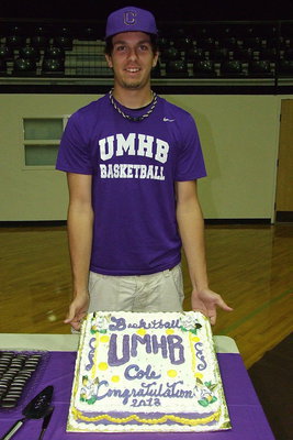 Image: Cole Hopkins displays the cake decorated to celebrate his signing to play basketball for the University of Mary Hardin-Baylor Crusaders (UMHB) in Belton, Texas. Cole was joined by a slew of supporters as the senior put the final icing on the cake to wrap up a tremendous career at Italy High School.