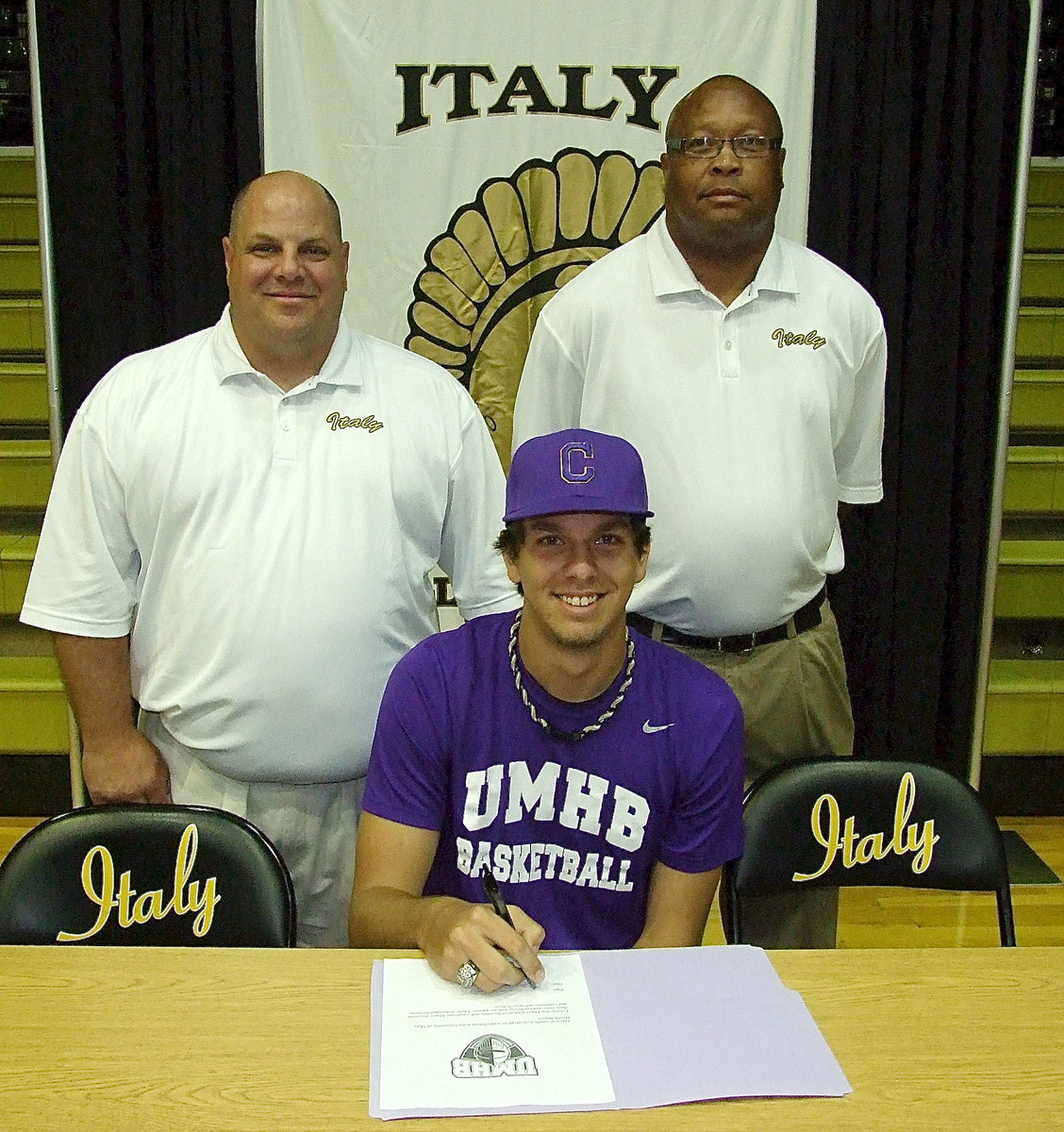 Image: Cole Hopkins with his Italy High School basketball coaches Brian Coffman and Larry Mayberry, Sr., as the talented senior prepares to sign his letter of intent to play basketball for the University of Mary Hardin-Baylor Crusaders.