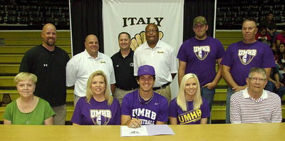 Image: Joining Cole Hopkins during signing his commitment to play college basketball for the University of Mary Hardin-Baylor Crusaders are (Back row): Italy AD/HFC Hank Hollywood; basketball coaches Brian Coffman, Josh Ward and Larry Mayberry; brother Jacob Hopkins and father Brad Hopkins. (Front row): Grandmother Sandra Maricle, mother Cassandra Hopkins, Cole Hopkins, sister Megan Hopkins, and grandfather Lawrence Maricle.