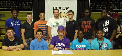 Image: Cole Hopkins is joined by his fellow senior boy student-athletes who are supporting Cole as he signs his commitment letter to the University of Mary Hardin-Baylor to play basketball for the Crusaders. (Back row): Paul Harris, Hayden Woods, Reid Jacinto, Zackery Boykin, Chase Hamilton, Ryheem Walker and Adrian Reed. (Front row): Blake Vega, Caden Jacinto, Cole Hopkins, Marvin Cox and Jalarnce Lewis.