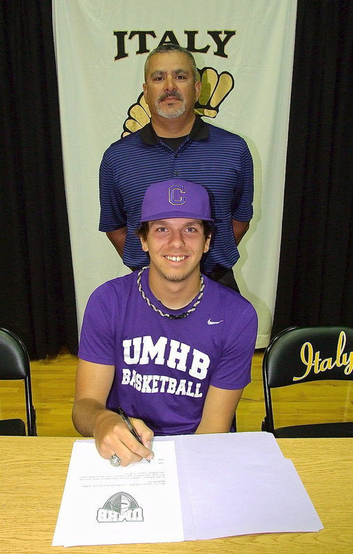 Image: Cole Hopkins with his pee-wee basketball coach, Mark Jacinto, as Cole’s prepares to sign his letter of intent to play basketball for the University of Mary Hardin-Baylor Crusaders.