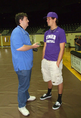 Image: Italy Gladiator senior, Cole Hopkins, being interviewed by Billy Wessels of Waxahachie Daily Light Sports, during Hopkins’ signing party as he selects the University of Mary Hardin-Baylor Crusaders to play collegiate basketball. Hopkins, received a full scholarship to attend UMBH.