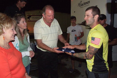 Image: After arriving in Italy around 12:30 a.m. and after Birdman received a medical checkup and food, City of Italy mayor James Hobbs presents Birdman with an American flag and thanks him for his service to our country.