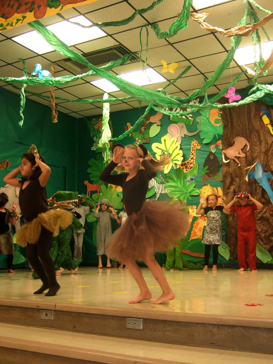 Image: Two of the monkeys yelling, “Nano Nano Boo Boo” at the alligator.