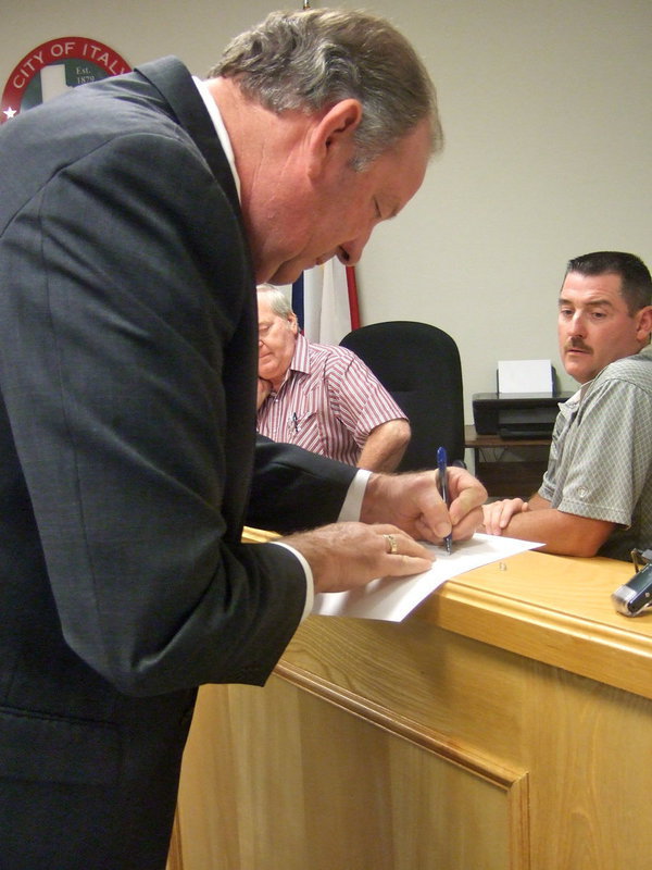 Image: Mayor Hobbs making it official with his signature.