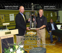 Image: Barry Gurley with North Texas Chevrolet presents Italy High School and AD/HFC Hank Hollywood with the Chevrolet Class A 2012 Team of the Year Award during the Italy Athletic Banquet held this past Friday night inside Italy Coliseum. The Gladiators turned a sluggish start to their season into a high-powered finish that culminated in a State Semifinal appearance.