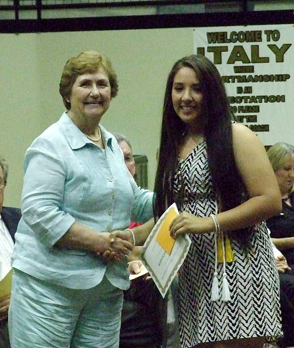 Image: The beloved, Wanda Scott, presents the Italy ISD George E. Scott Memorial Scholarship, $500 per semester for up to four years, to graduating senior Alyssa Richards. Mrs. Scott presented the scholarship to 5 separate seniors.