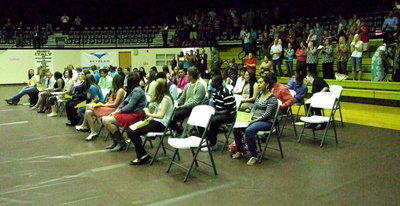 Image: The senior class of 2013 receives a standing ovation from those attending the senior awards assembly.