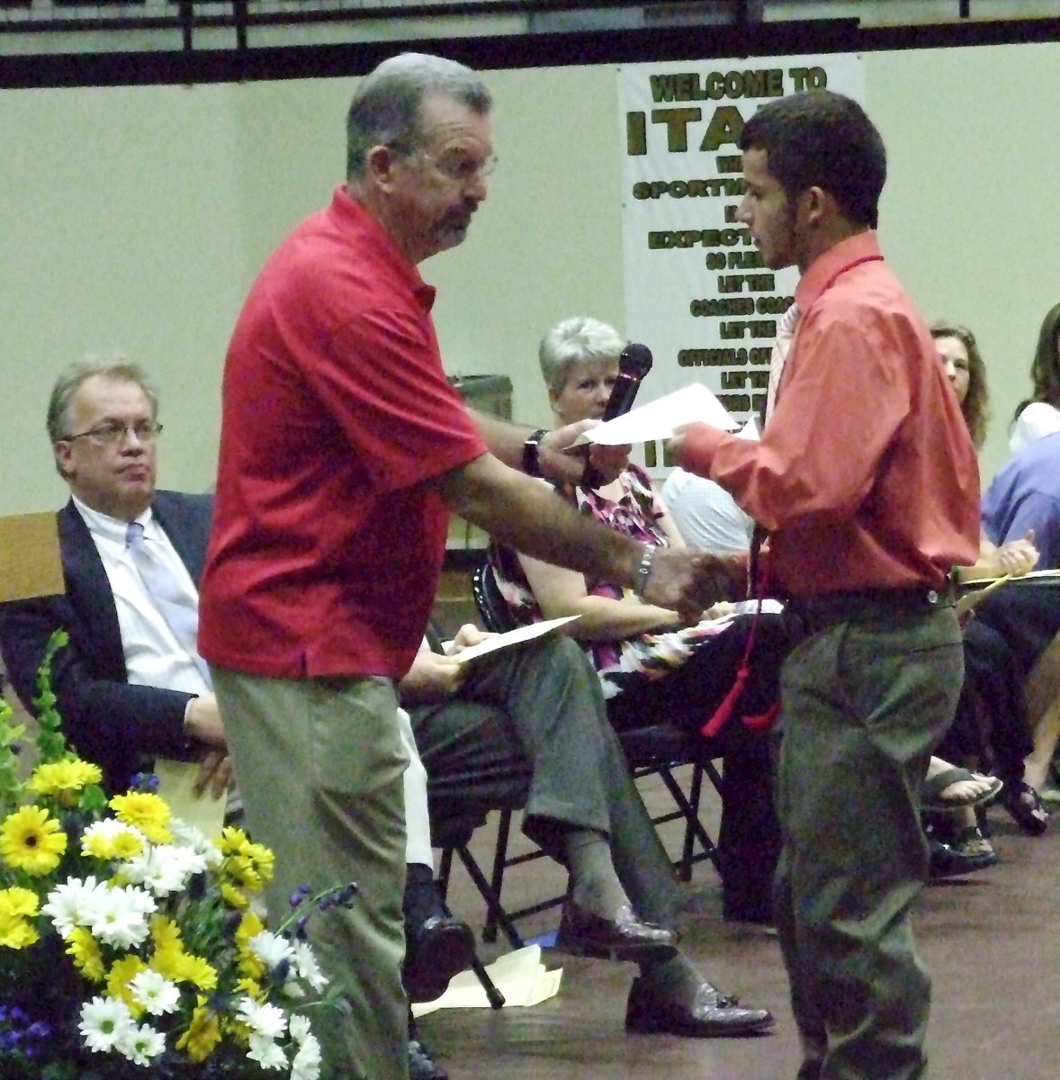 Image: Paul Tate, the president of Lone Star Cyclists from Grand Prairie who annually host Tour d’ Italia in Italy, presents the Lone Star Cyclists scholarship of $500 to senior Caden Jacinto. Katie Byers, Courtney Russell and Gus Allen each received the Lone Star Cyclists scholarship as well.