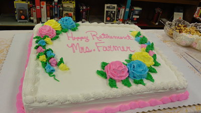 Image: The staff provides punch and cake for those attending the retirement reception for Sharan Farmer.