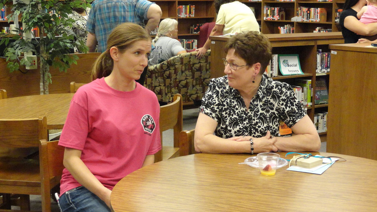 Image: Sharan Farmer gives last minute advise to incoming librarian Cassie Joffre.