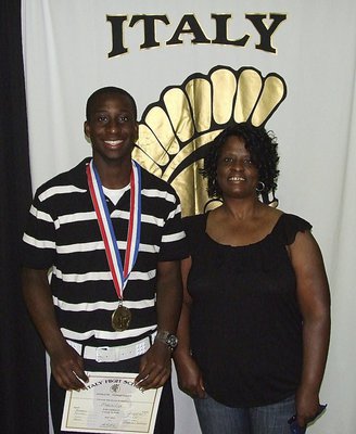 Image: Pictured with mother, Sharon Blackshire, senior Gladiator, Marvin Cox, displays his State semifinal medal and certificate of achievement.