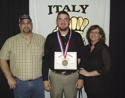 Image: Pictured with his parents, senior Gladiator, Zackery Boykin, uses ingenuity to display his State semifinal medal and certificate of achievement.