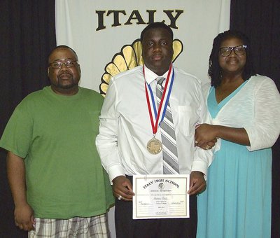 Image: Pictured with parents, Adrian and Brendetta Reed, senior Gladiator, Adrian Reed, displays his State semifinal medal and certificate of achievement.