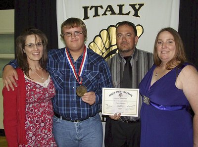 Image: Pictured with his mother, Laura Tuck, and aunt and uncle, Robin and paul Dodson is sophomore Gladiator, Colin Newman, who displays his State semifinal medal and certificate of achievement.