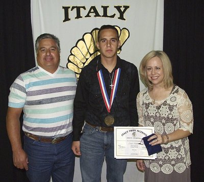 Image: Pictured with parents, Jerry and Jane Medrano, junior Gladiator, Cody Medrano, displays his State semifinal medal and certificate of achievement.