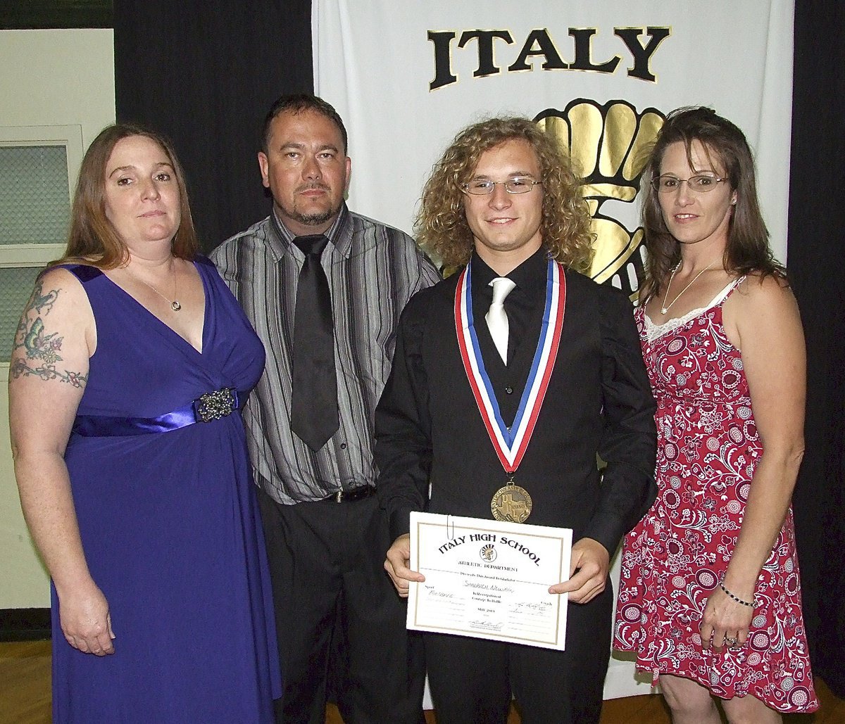 Image: Pictured with aunt and uncle, Robin and paul Dodson, and with his mother, Laura Tuck, is junior Gladiator, Shad Newman, who displays his State semifinal medal and certificate of achievement.