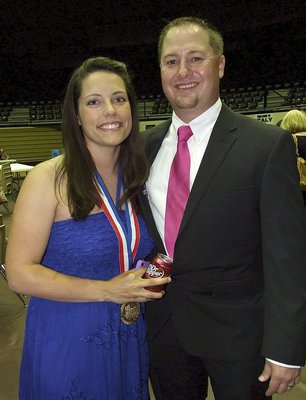 Image: Josh Ward and his wife Jessica help wrap up the banquet after a tremendous school year.