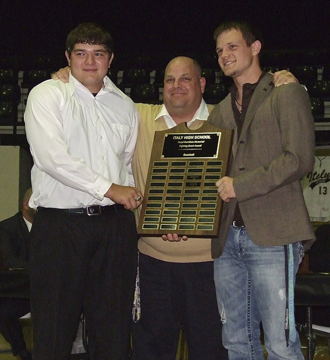 Image: Assistant baseball coach, Brian Coffman presents the Italy Fighting Heart Award to Gladiators Kevin Roldan and Gladiator Chase Hamilton.