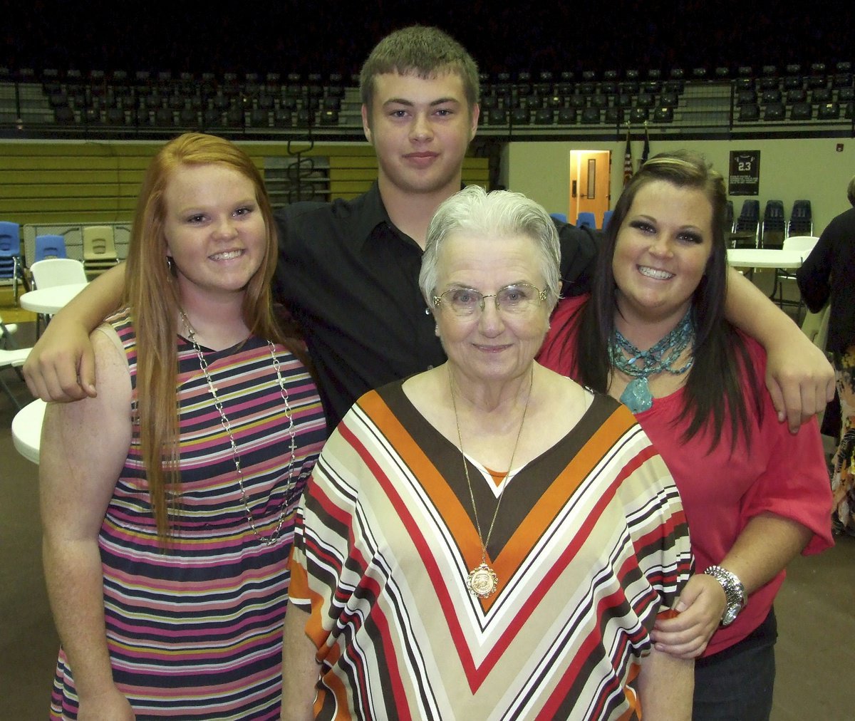 Image: Senior Katie Byers poses with her cousin Zain Byers, her sister Lauren Byers and her grandmother Ann Byers at the conclusion of the banquet.