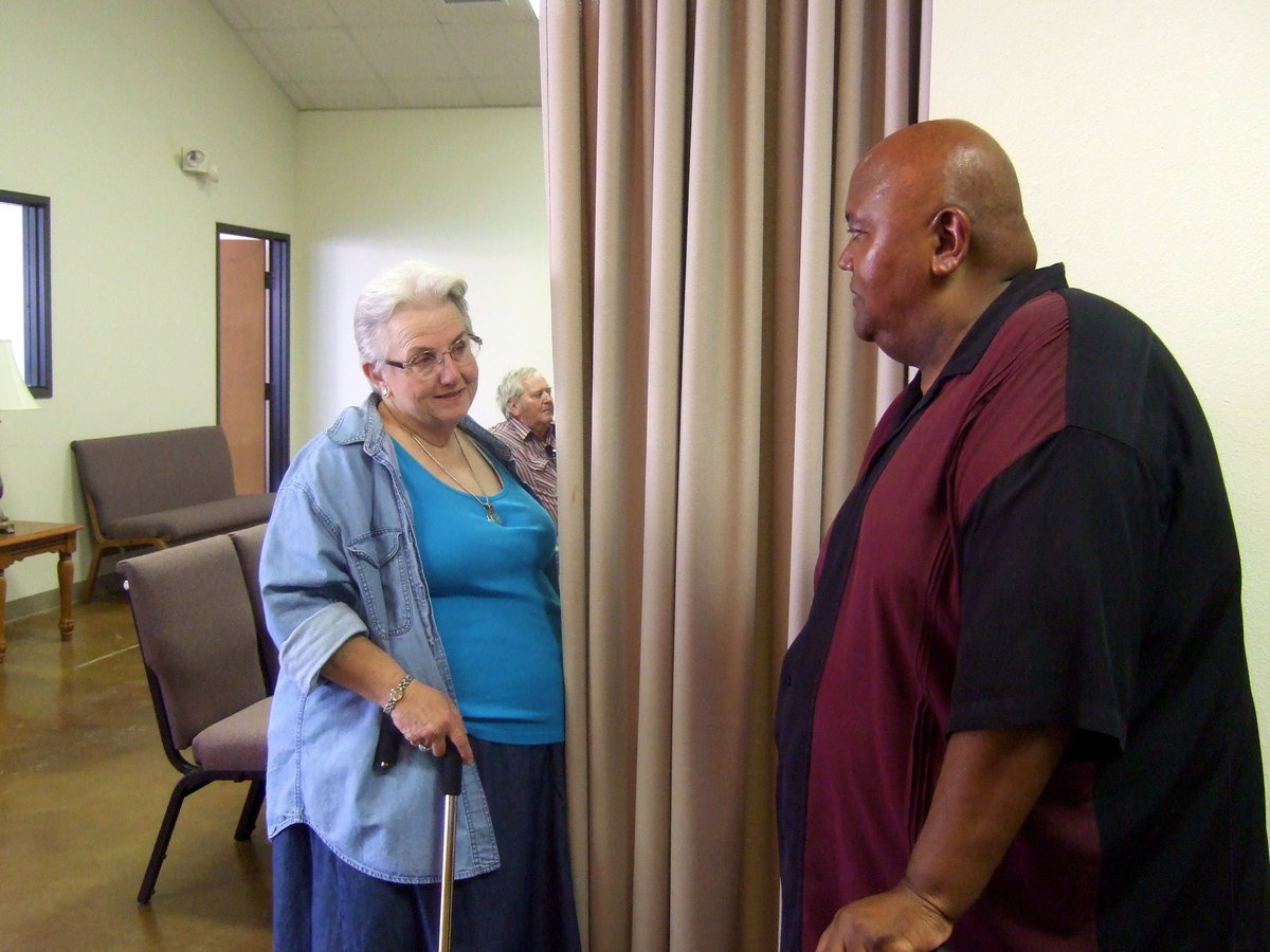 Image: Ann Byers visiting with Frank Jackson.