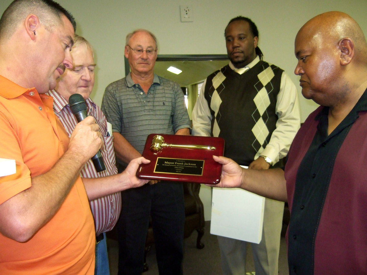 Image: City Council members present Frank with a plaque and gavel in appreciation of his 14 years of service to the city.