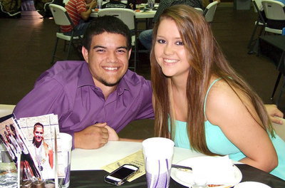 Image: Juniors, Tyler Anderson and Paige Westbrook, take a ‘couple’ of photos while enjoying the banquet.
