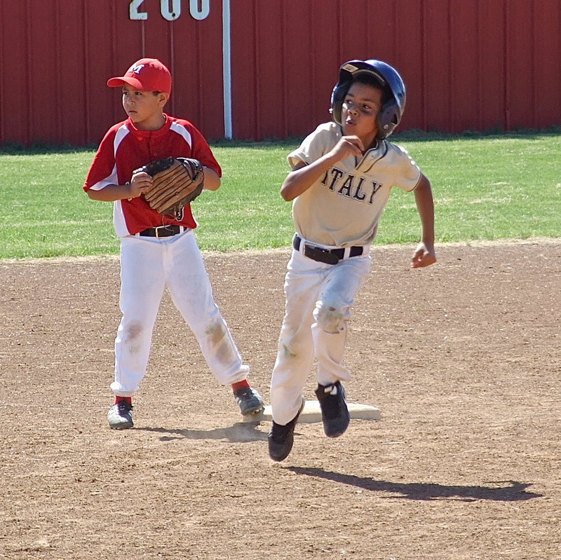 Image: Italy Gold’s, Jalyn Wallace(1), rounds second base on his way to an inside the park home run against Maypearl to help propel Italy to a 8U boys championship victory.