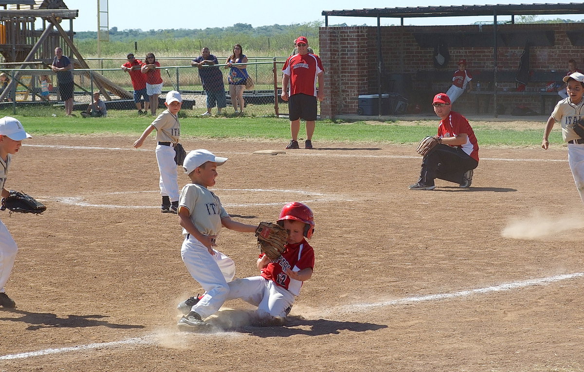 Image: Maypearl takes the bait and Jalyn Wallace(1) throws the ball to teammate Gavin Ramirez(6) who makes the tag at third to catch the greedy Maypearl runner trying to slide back to the bag for the second out. Maypearl’s next batter struck out to end the game with Italy Gold earning the championship with an 11-7 victory.