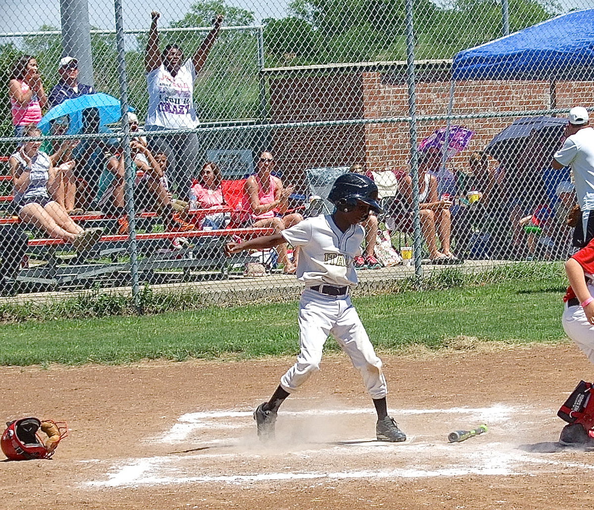 Image: Stepping on home plate to complete his home run is Italy White’s, John Hall(9), as his mother, Latoya Hall, celebrates in the stands.