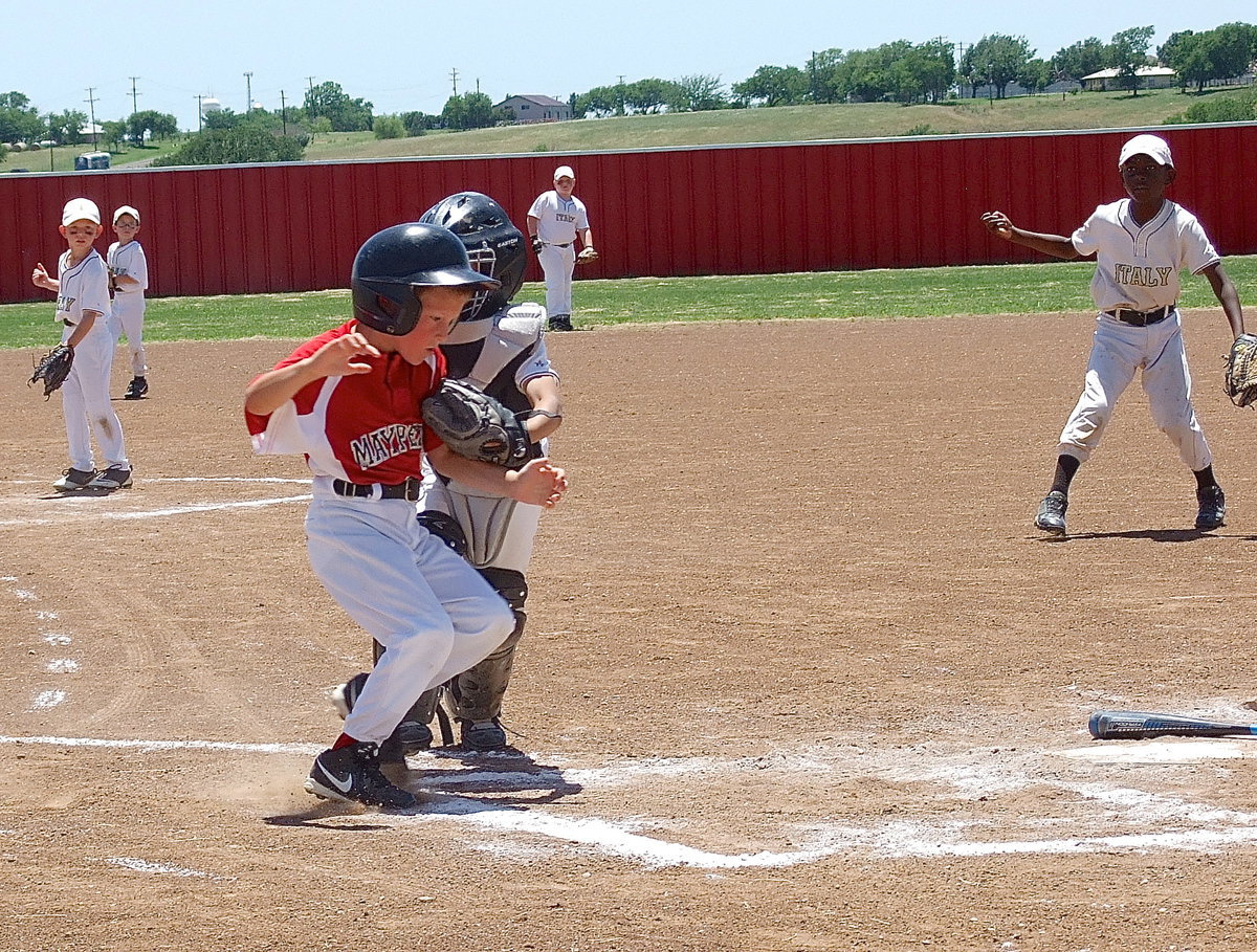 Image: Hayden makes the tag from his catcher’s position after second baseman, Austin Cate, put the relay throw on the money.