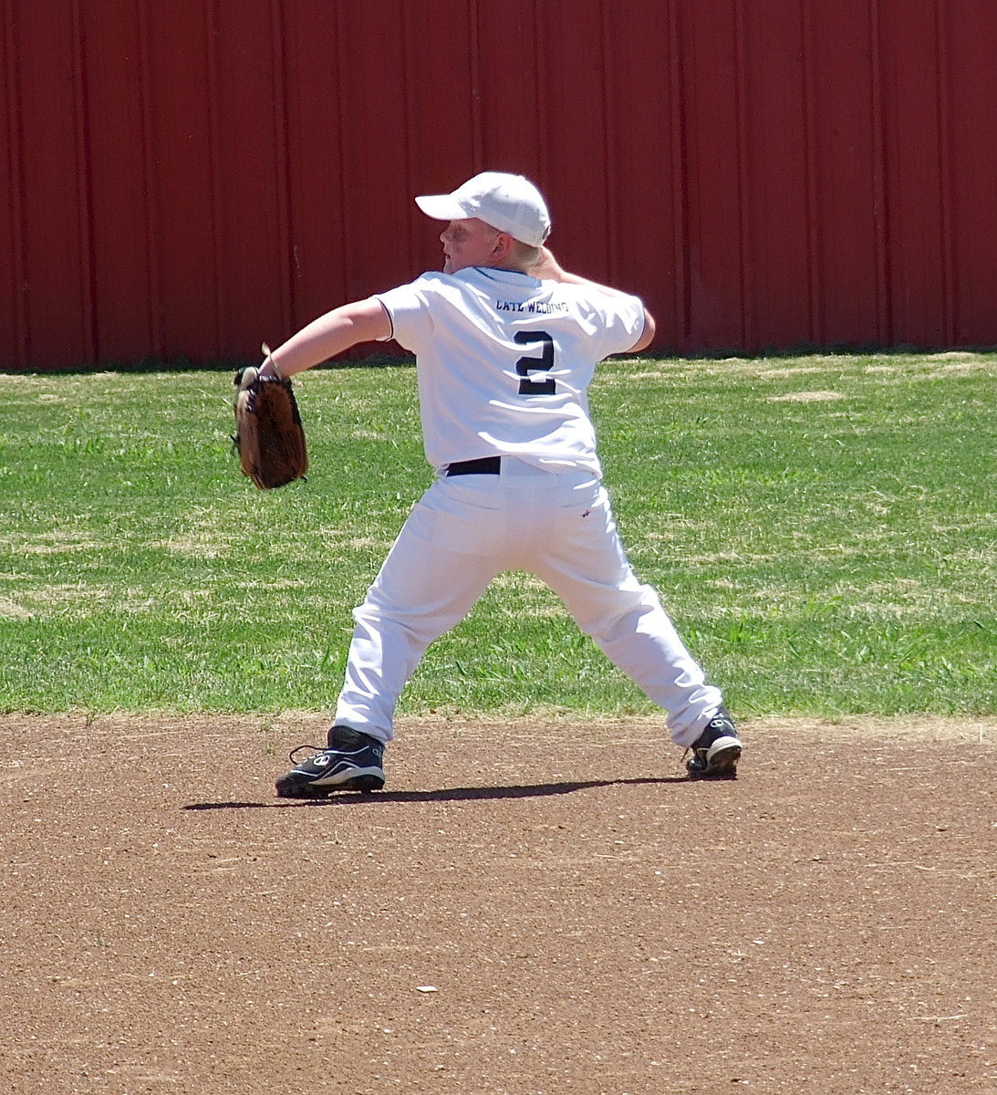 Image: Right fielder, Bryce Ballard(2) throws the ball into the infield after a Maypearl hit.